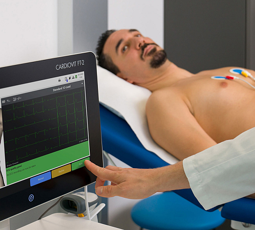 A male patient having a 12 lead ECG performed on them